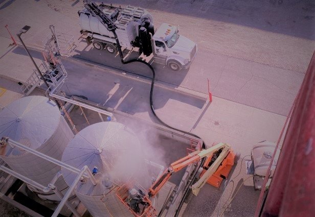 Enviro-Dyne technician hydroblasting a process tank at an ethanol plant